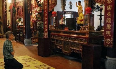 A Man Prays At Quyet Pagoda